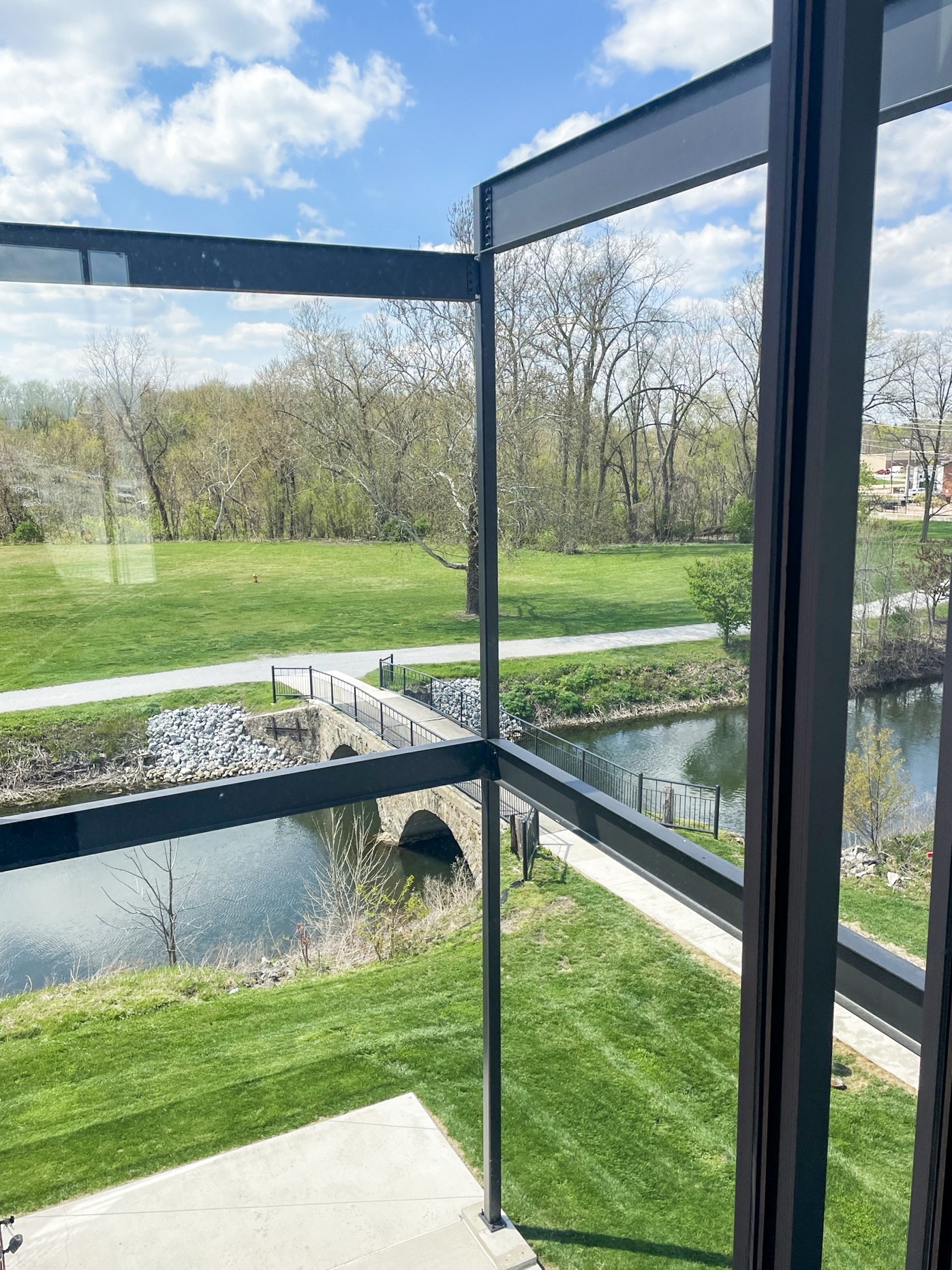 a view of a bridge over a body of water from a window
